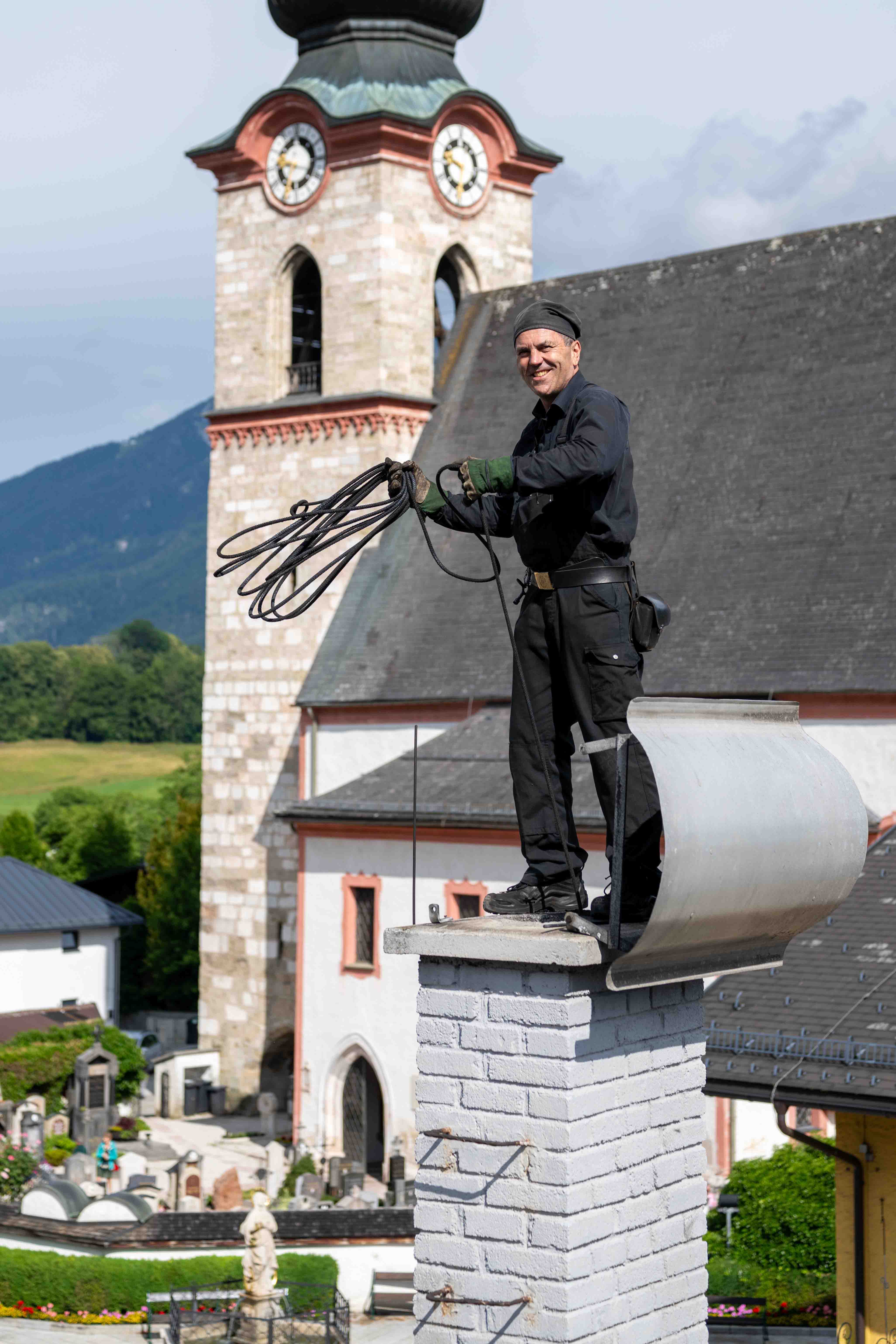 Rauchfangkehrer auf Kamin
